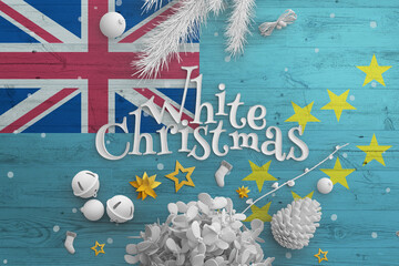 Tuvalu flag on wooden table with White Christmas text. Christmas and new year background,...