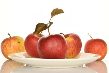 Ripe red apples, close-up, on a white background.