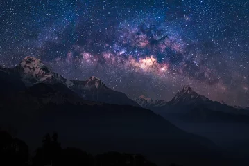 Wall murals Dhaulagiri Nature landscape view of Himalayan mountain range with universe space of milky way galaxy and stars on night sky