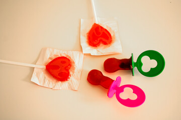 red lollipops and caramel pacifiers