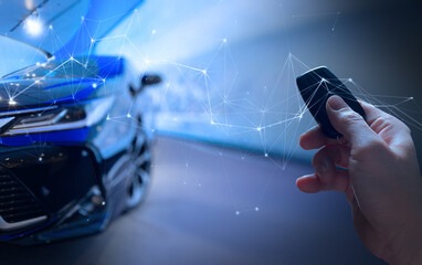 Men's hand presses on the smart remote control car with technology transportation safety AR concept