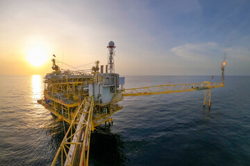 Offshore oil and gas or rig platform with beautiful sky in the evening time for oil and gas...