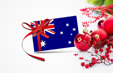 Australia flag on new year invitation card with red christmas ornaments concept. National happy new year composition.