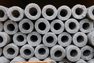 Stacked insulation for pipes of polyethylene foam in warehouse