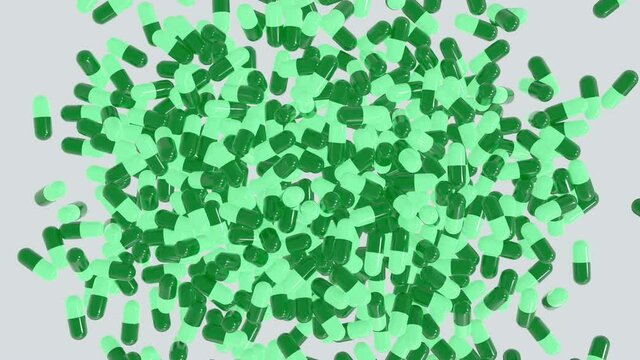 Top view of many capsule pills (green capsule) drop from the top in different position. Drugs for treatment medication. Anti covid. 3D rendering