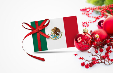 Mexico flag on new year invitation card with red christmas ornaments concept. National happy new year composition.