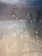 Water drops on a plastic bottle surface. Selective focus this image