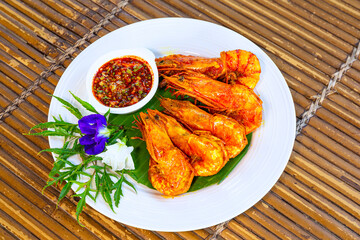 Fried shrimps on a plate with vegetables