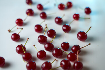Obraz na płótnie Canvas Group of cherry on a white background with shadows. Close-up. Top view.