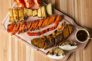 grilled vegetables on wooden background