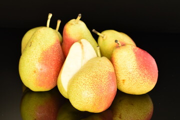 Fototapeta na wymiar Sweet ripe pears, close-up, on a black background.