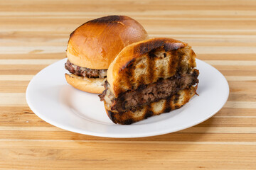 burger on a plate on wooden background