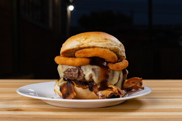 burger on a plate on wooden background