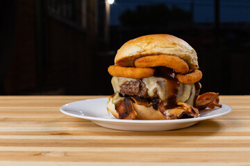 burger on a plate on wooden background