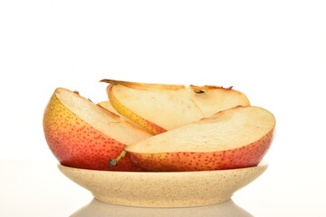 Sweet ripe pear, close-up, on a white background.