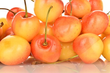 Yellow sweet cherry, close-up, on a white background.