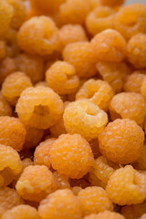 yellow raspberries in vertical format. Close up view