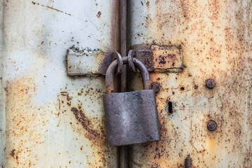 old lock on an iron rusty door. Close up macro