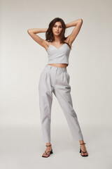 Fashion pretty woman beautiful makeup perfect body shape tanned skin wear clothes summer collection...