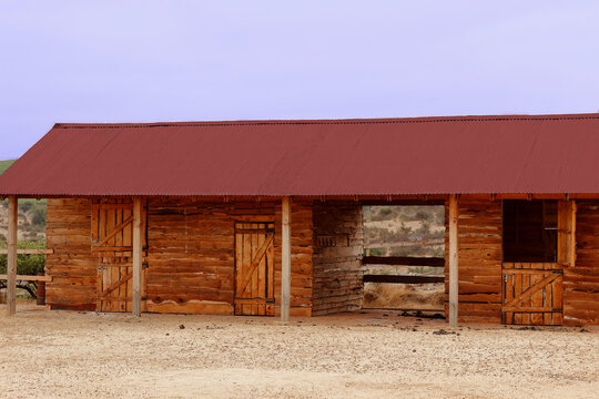 a wooden stable in chilean country landscape