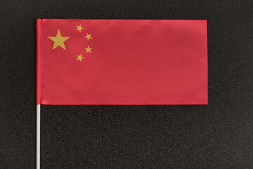 Table flag of China on black background. National symbol of Peoples Republic of China