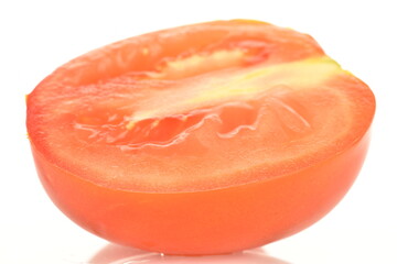 Red plum tomato, macro isolated on a white background.
