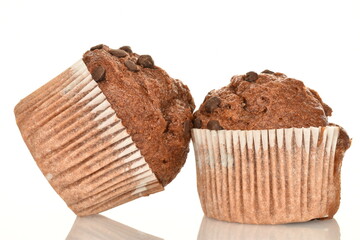 Chocolate muffins, close-up, isolated on a white background.