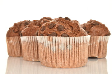 Chocolate muffins, close-up, isolated on a white background.