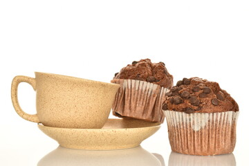 Chocolate muffins, close-up, isolated on a white background.