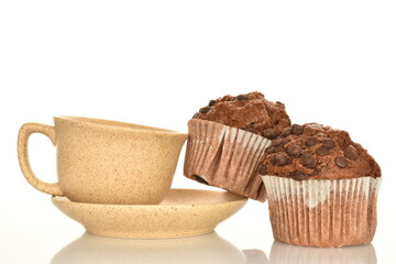 Chocolate muffins, close-up, isolated on a white background.