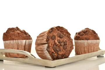 Chocolate muffins, close-up, isolated on a white background.