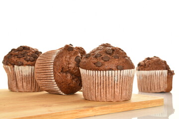 Chocolate muffins, close-up, isolated on a white background.