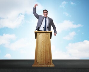 Man businessman making speech at rostrum in business concept