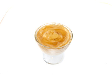 Greek yogurt with honey dessert. yogurt with honey, orange, and lavender. White background and Greek blue color. Isolated on white.
