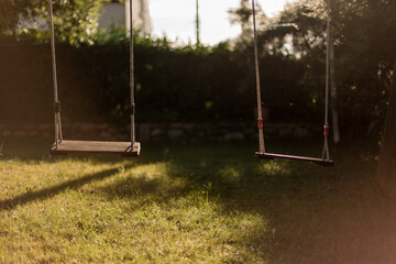 empty swings in a garden