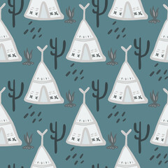 Cute teepee seamless pattern on green background. Native style. Tribal wallpaper. © smth.design