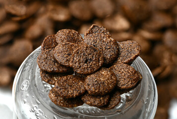 Breakfast cereal balls with chocolate on a white background