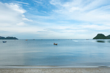 Fototapeta na wymiar Fishing boat in the sea and blue sky background.