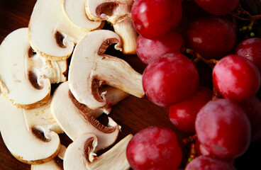 Mushrooms and red grapes fresh food
