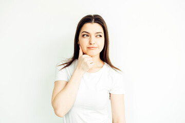 Young girl 25 years old, emotion - doubt. White background