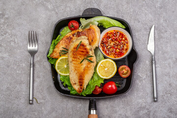 Delicious fried chicken breast and vegetable salad