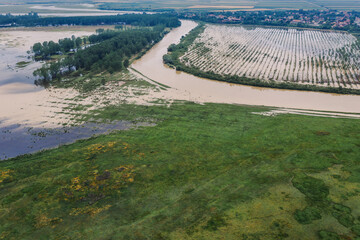 Flooded plain countryside landscape and river from drone pov