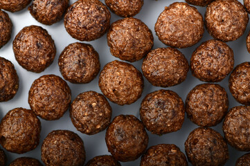 Breakfast cereal balls with chocolate on a white background