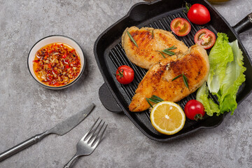 Delicious fried chicken breast and vegetable salad