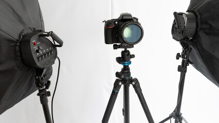 Dslr camera on tripod wirt two soft box. Studio set for shooting