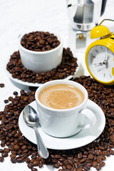 espresso cup on coffee beans, vertical