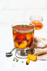 flavored black tea with plums, berries and thyme, vertical top view