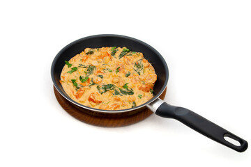 Shrimps with butter sauce placed in a skillet. Pasta with butter sauce shrimps.