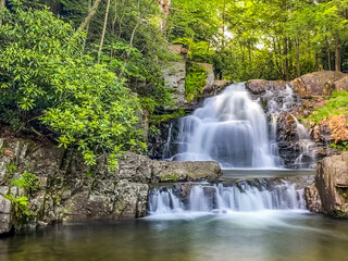 Fototapeta na wymiar Stock photo of small waterfall in the mountains