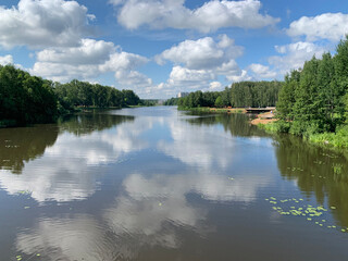 Moscow region, the city of Balashikha. Clouds over Pekhorka river in summer day